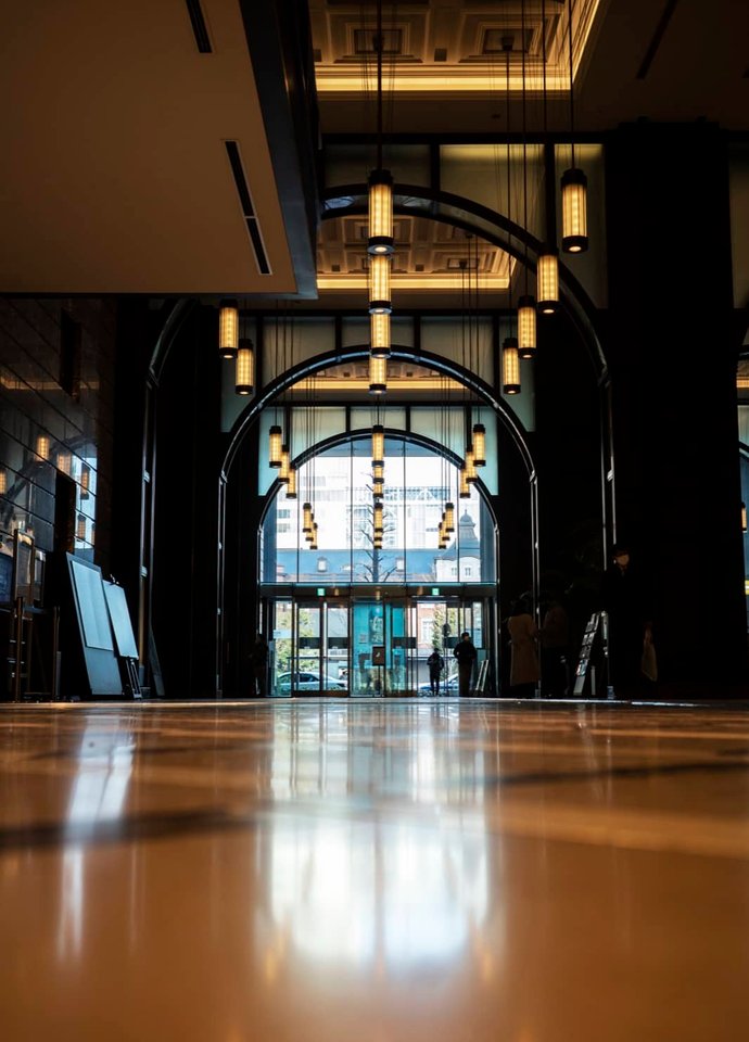 Hotel lobby with polished floors and warm lighting.